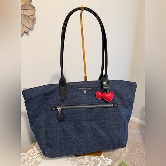 Michael Kors Handbags - Michael Kors Denim Tote with Luggage sleeve Dusty and charm included 18x12